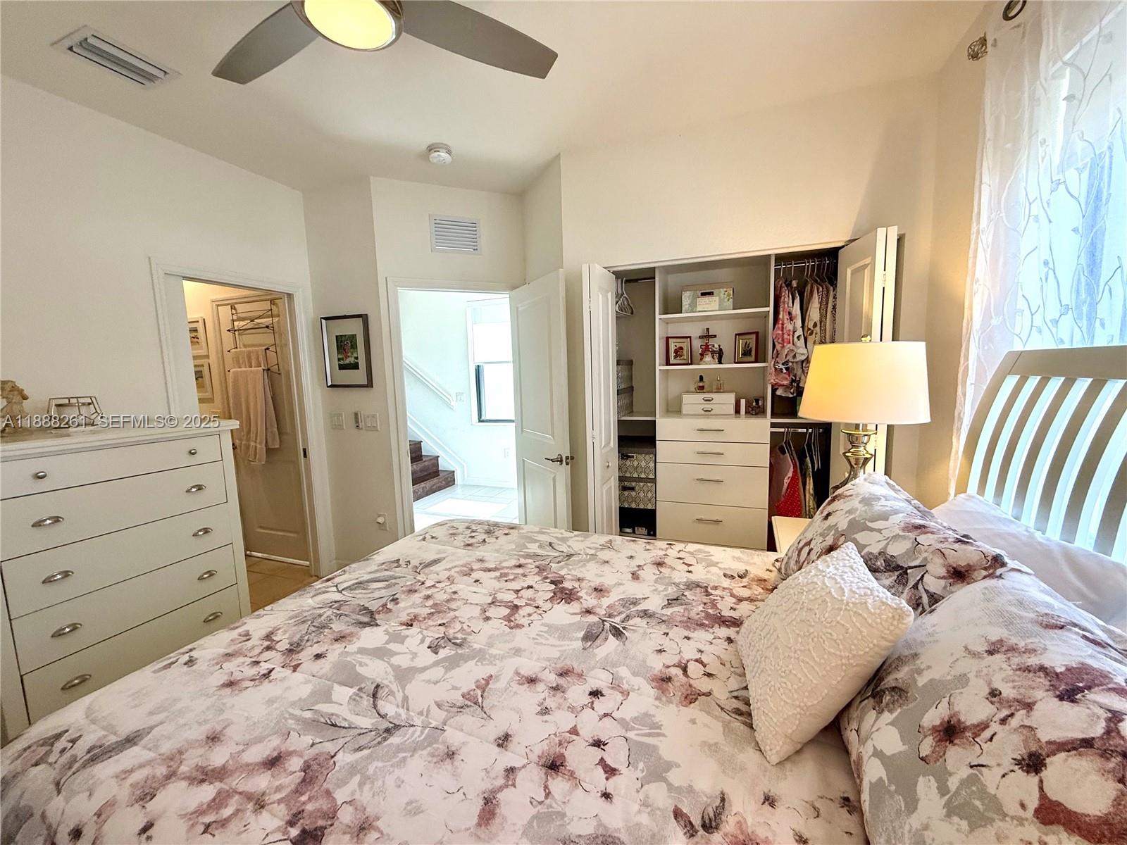 400 Northeast 208th Terrace, Unit 400 Miami, FL 33179 - Photo 35 of 53 a bedroom with a bed and a dresser