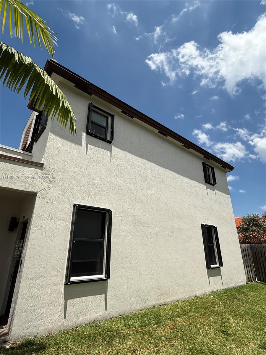 400 Northeast 208th Terrace, Unit 400 Miami, FL 33179 - Photo 42 of 53 a front view of a house with entryway
