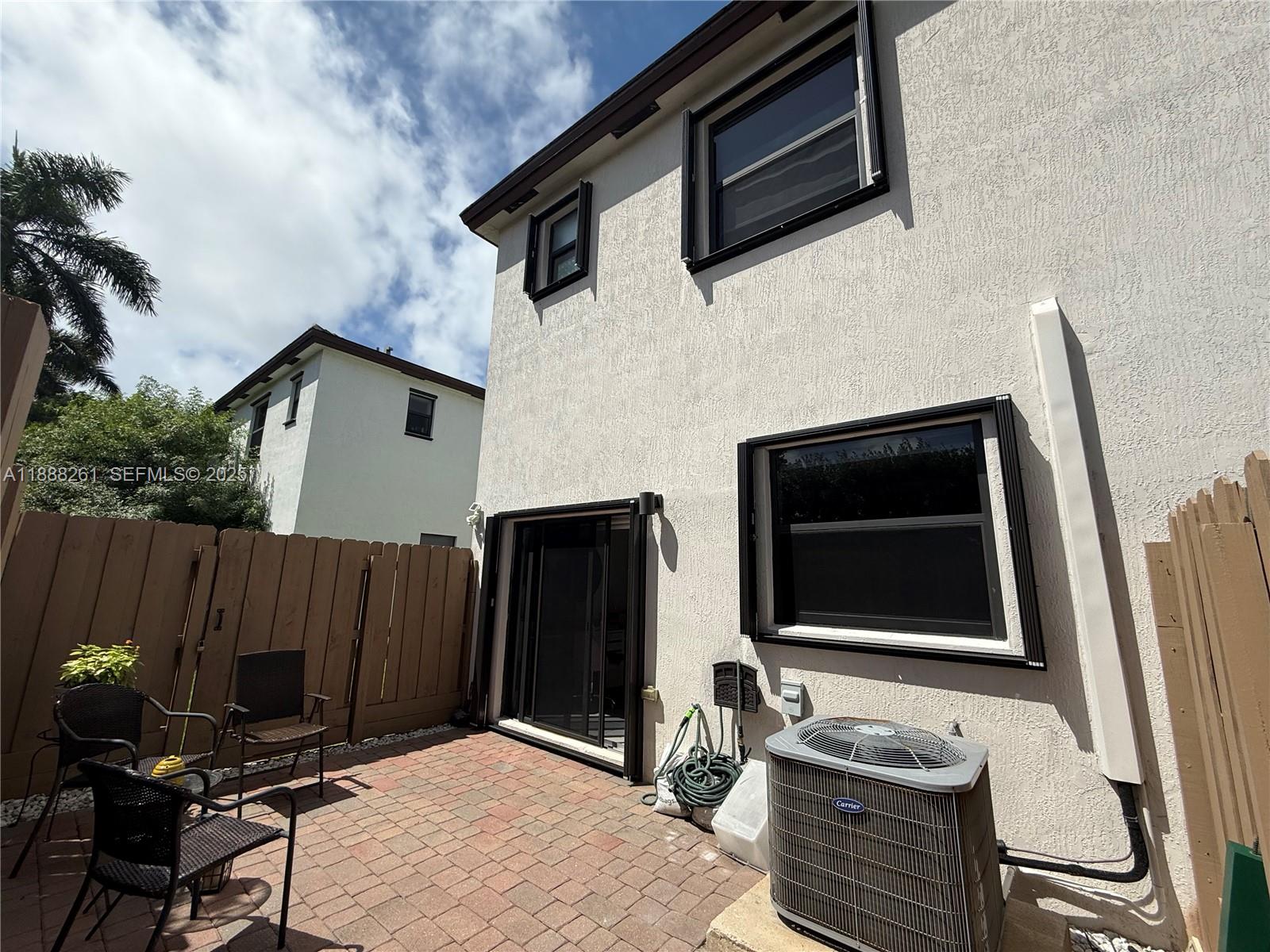 400 Northeast 208th Terrace, Unit 400 Miami, FL 33179 - Photo 45 of 53 a house with outdoor space