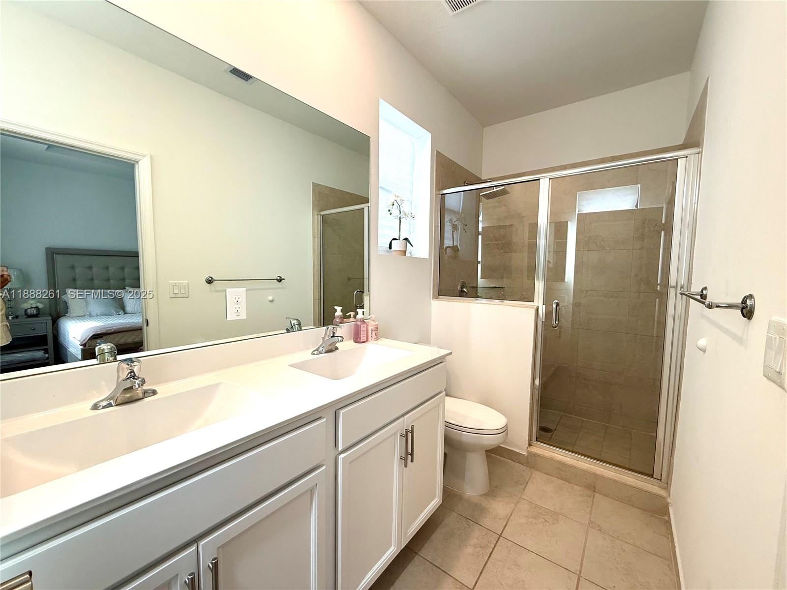 400 Northeast 208th Terrace, Unit 400 Miami, FL 33179 - Photo 8 of 53 a bathroom with a sink a toilet and shower