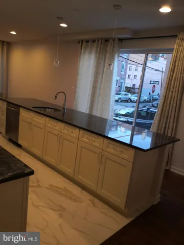 an empty room with wooden floor