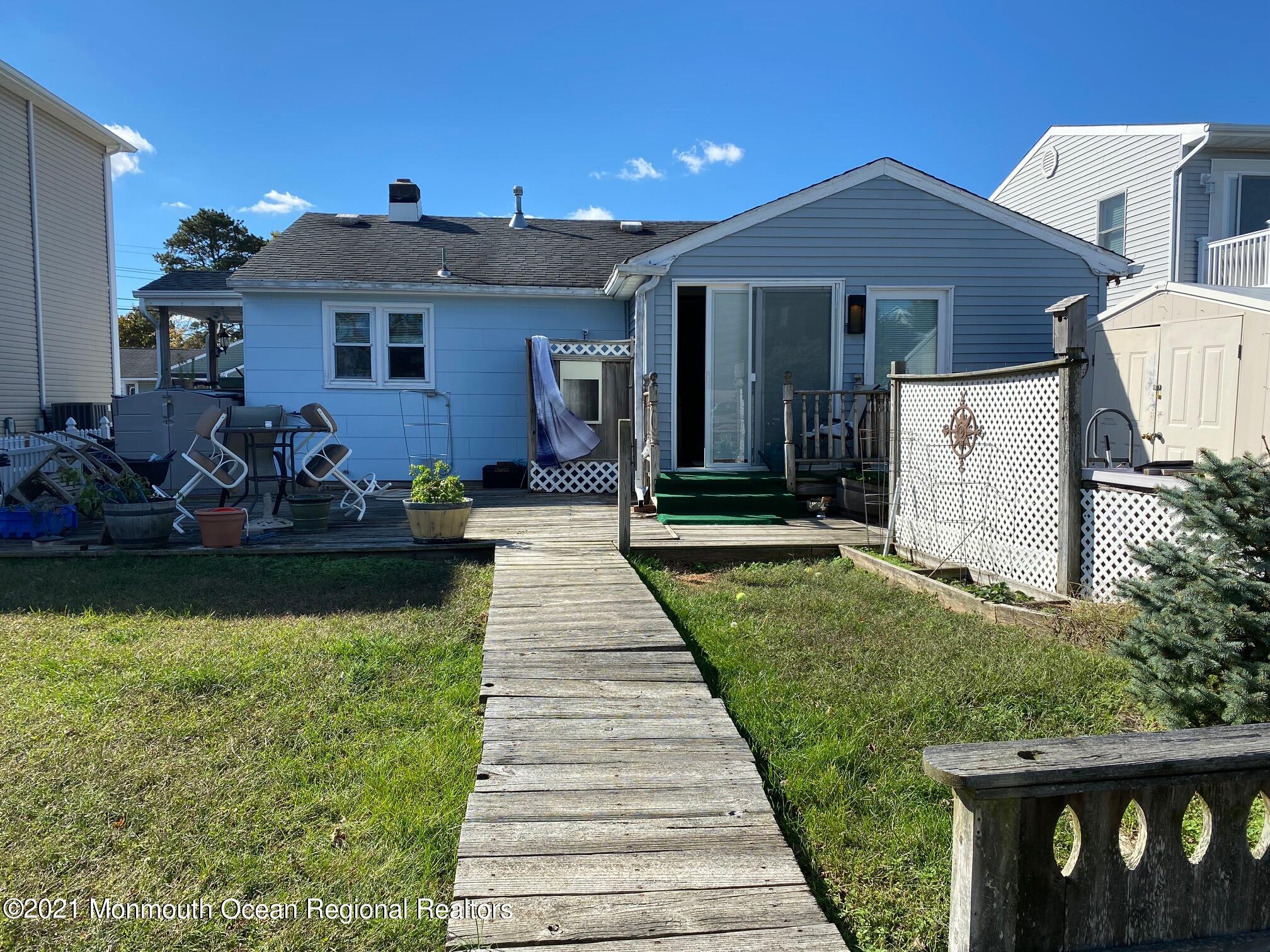 65 Topsail Road Brick, NJ 08723 - Photo 11 of 15 a front view of a house with garden