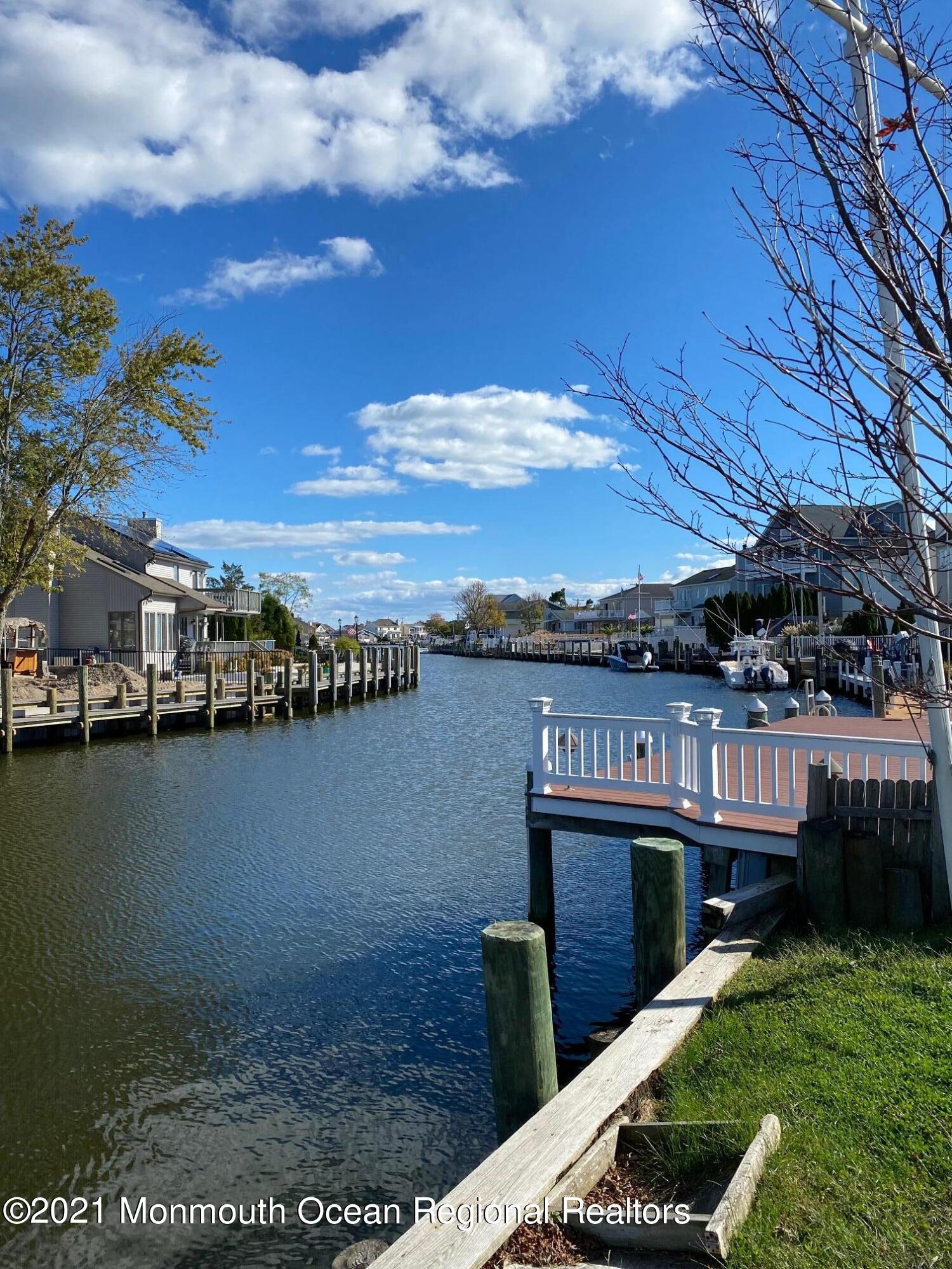 65 Topsail Road Brick, NJ 08723 - Photo 12 of 15 a view of a lake from a yard