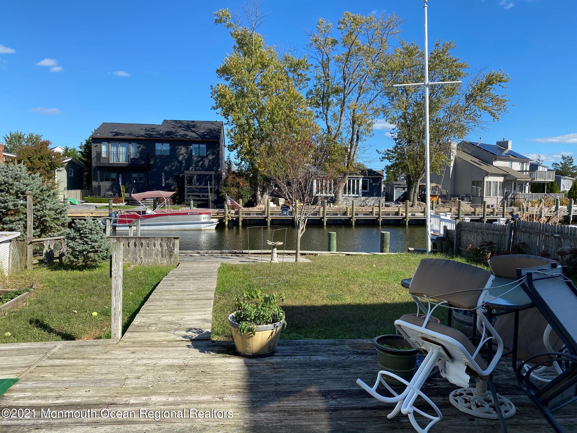 65 Topsail Road Brick, NJ 08723 - Photo 13 of 15 a view of a patio with chair and tables