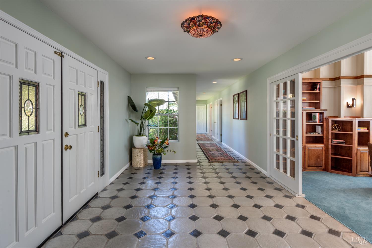 4133 Orr Ranch Road Santa Rosa, CA 95404 - Photo 15 of 50 a view of a hallway with wooden floor and furniture