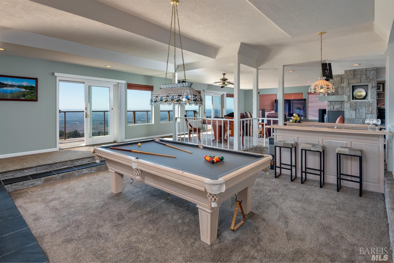 4133 Orr Ranch Road Santa Rosa, CA 95404 - Photo 27 of 50 a living room with a table chairs and a large window