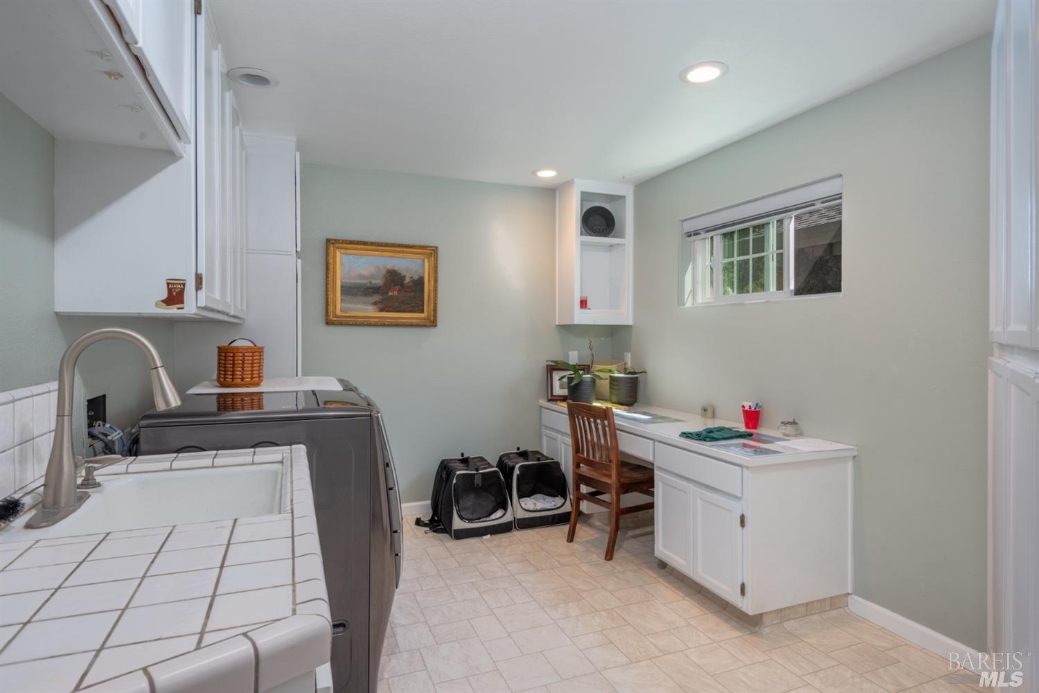 4133 Orr Ranch Road Santa Rosa, CA 95404 - Photo 37 of 50 a view of a workspace with furniture and a window