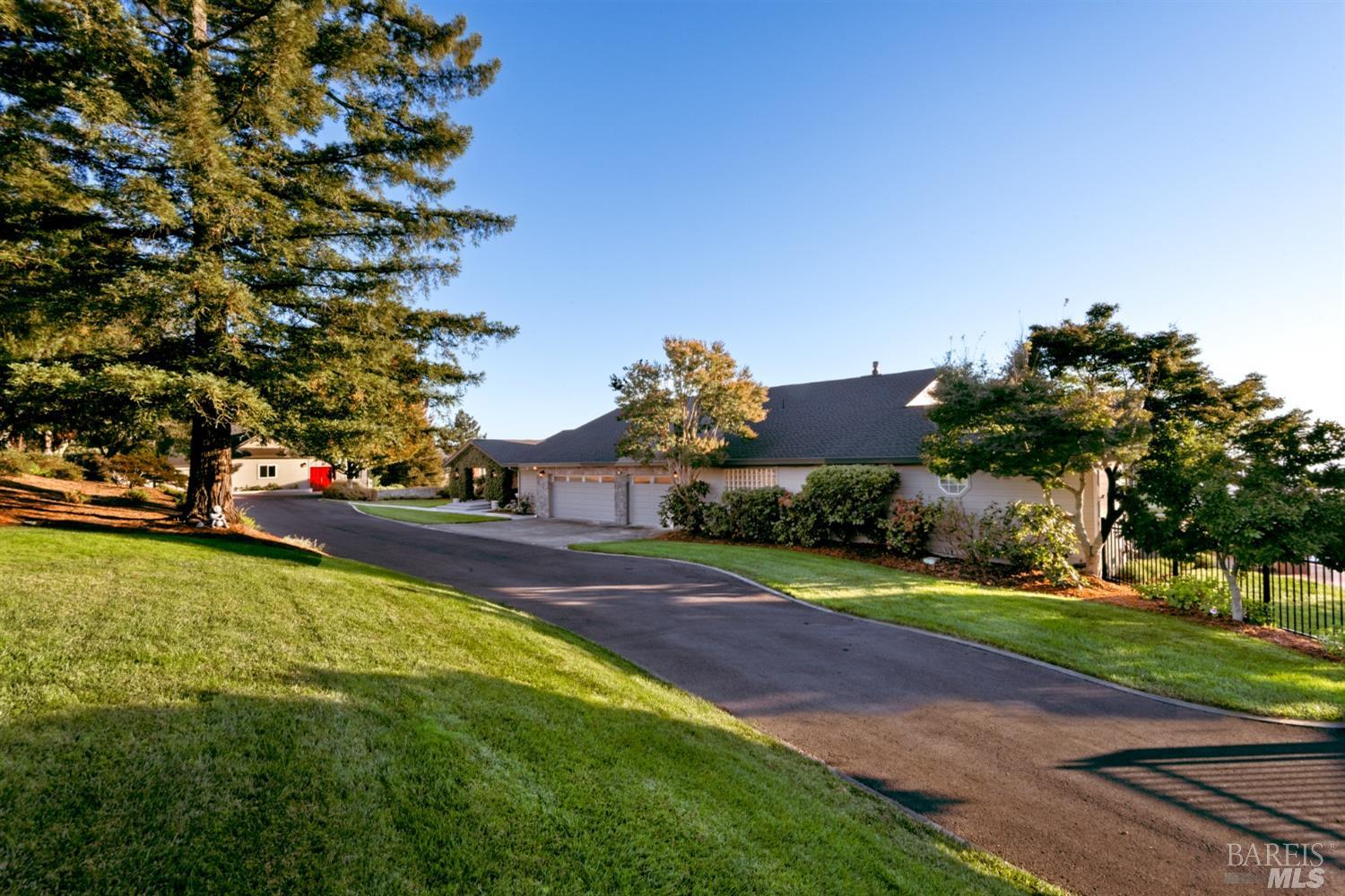 4133 Orr Ranch Road Santa Rosa, CA 95404 - Photo 4 of 50 a front view of a house with a yard and a large tree