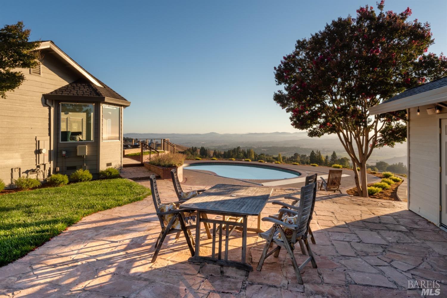 4133 Orr Ranch Road Santa Rosa, CA 95404 - Photo 10 of 50 a patio with a table and chairs and potted plants