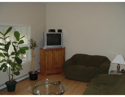 2 Boxberry Drive Rochester, MA 02770 - Photo 5 of 10 a living room with furniture and a flat screen tv