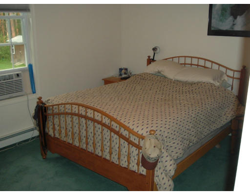 2 Boxberry Drive Rochester, MA 02770 - Photo 8 of 10 a bedroom with a bed and a window