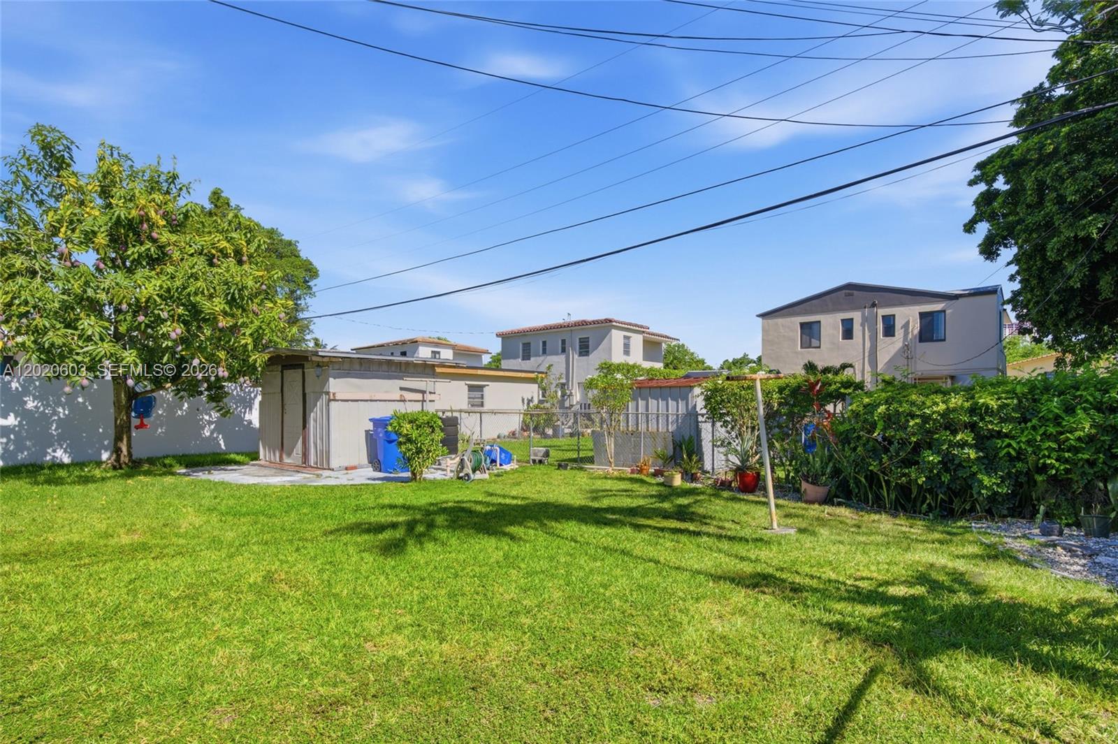 3750 Southwest 27th Street Miami, FL 33134 - Photo 31 of 41 a view of a house with a big yard and potted plants