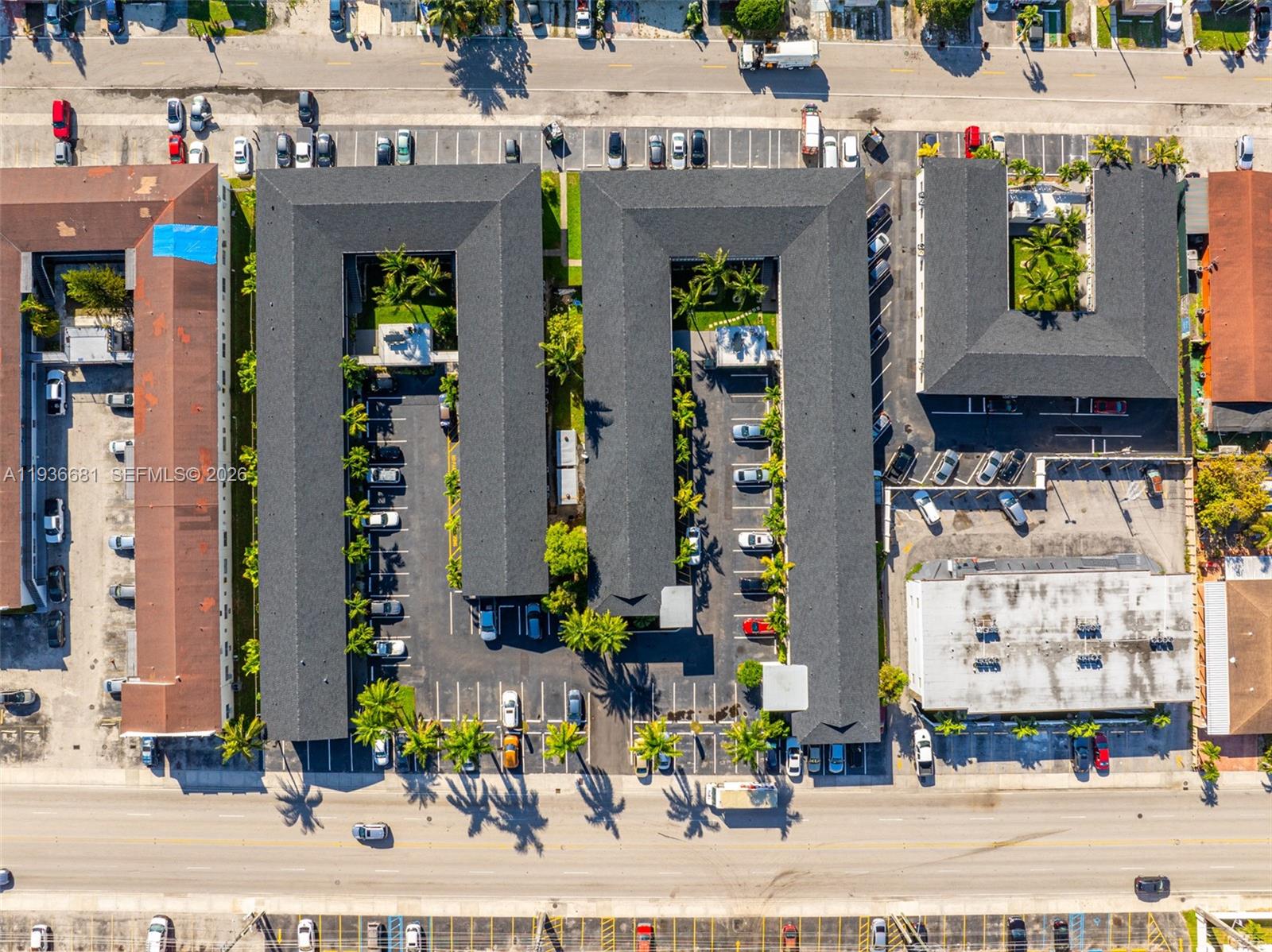 1310 West 29th Street, Unit 22 Hialeah, FL 33012 - Photo 12 of 14 a front view of a building with sign board