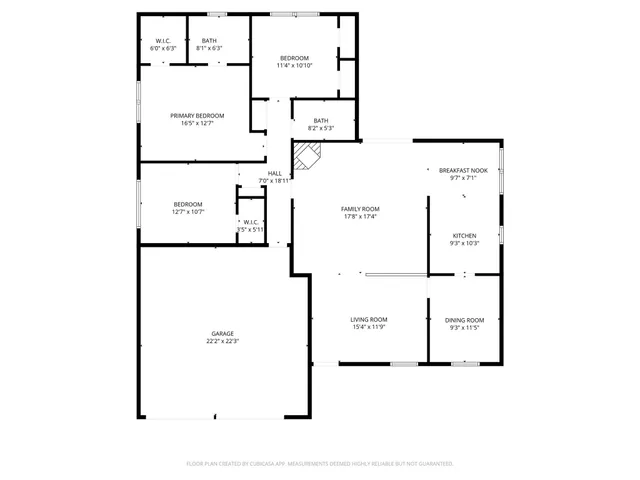 a view of a backyard with a tree