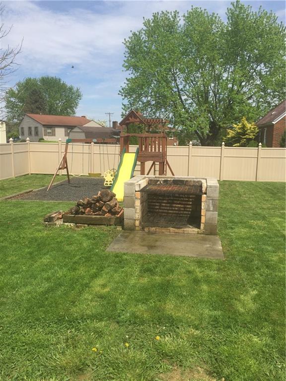 708 Walnut Street Monongahela, PA 15063 - Photo 19 of 22 Fenced in yard with a play area and built-in grill.