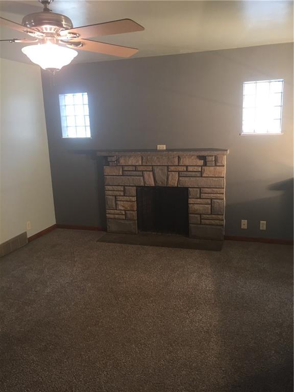 708 Walnut Street Monongahela, PA 15063 - Photo 7 of 22 Fireplace in the living room with glass block windows!