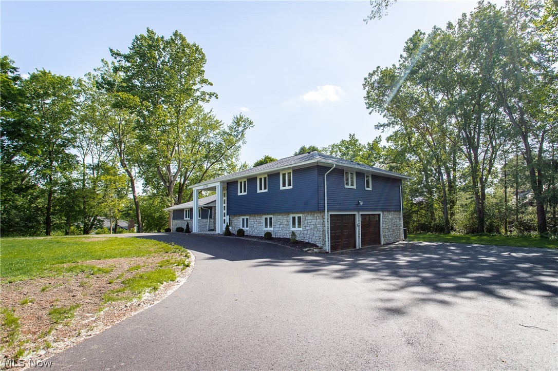 2728 Lander Road Cleveland, OH 44124 - Photo 2 of 50 Raised ranch featuring a garage