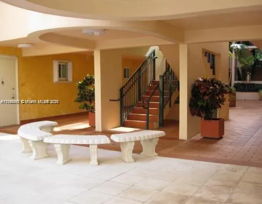 a view of living room filled with furniture