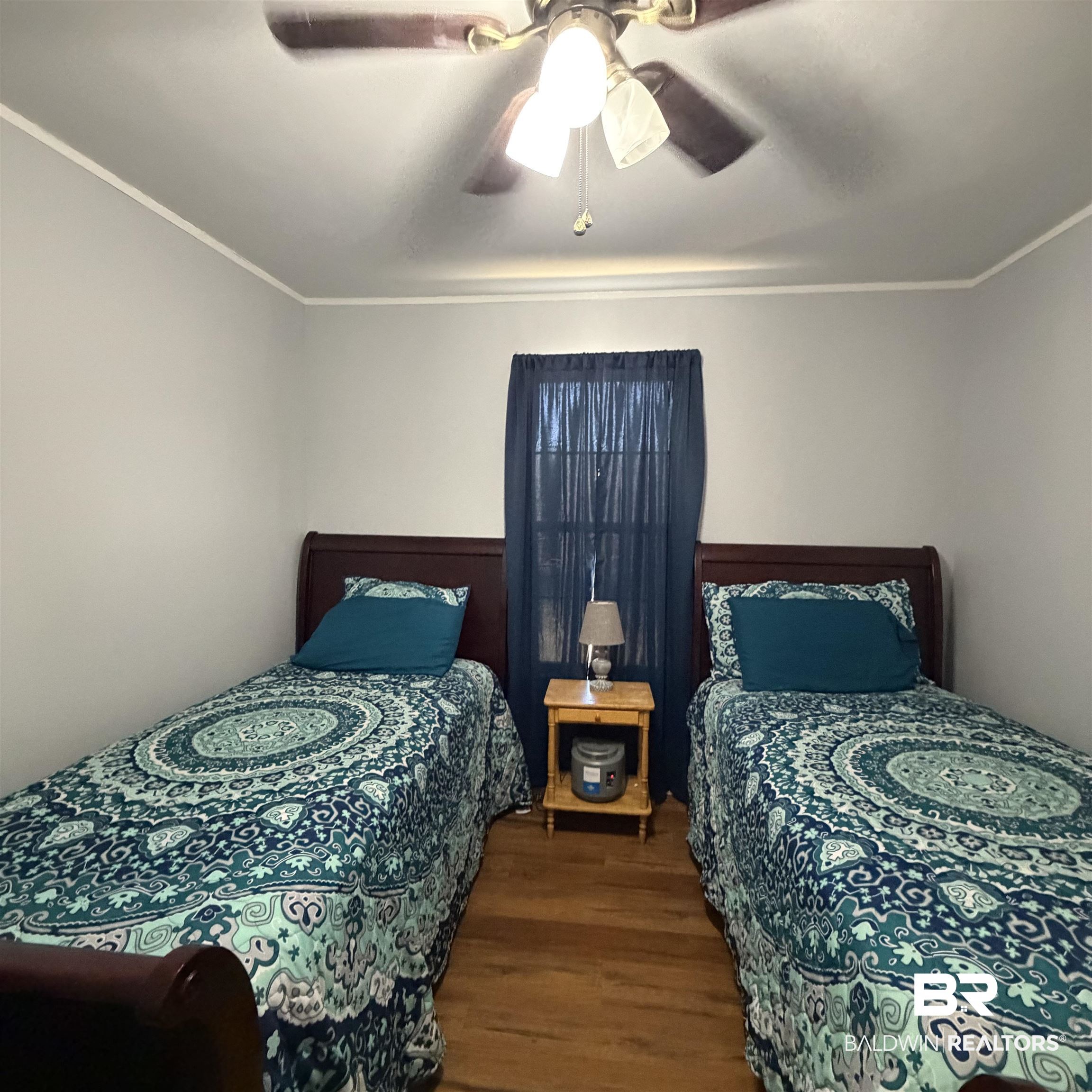 447 Sugar Hill Road Monroeville, AL 36460 - Photo 17 of 27 Bedroom featuring ornamental molding, dark wood-style flooring, and ceiling fan