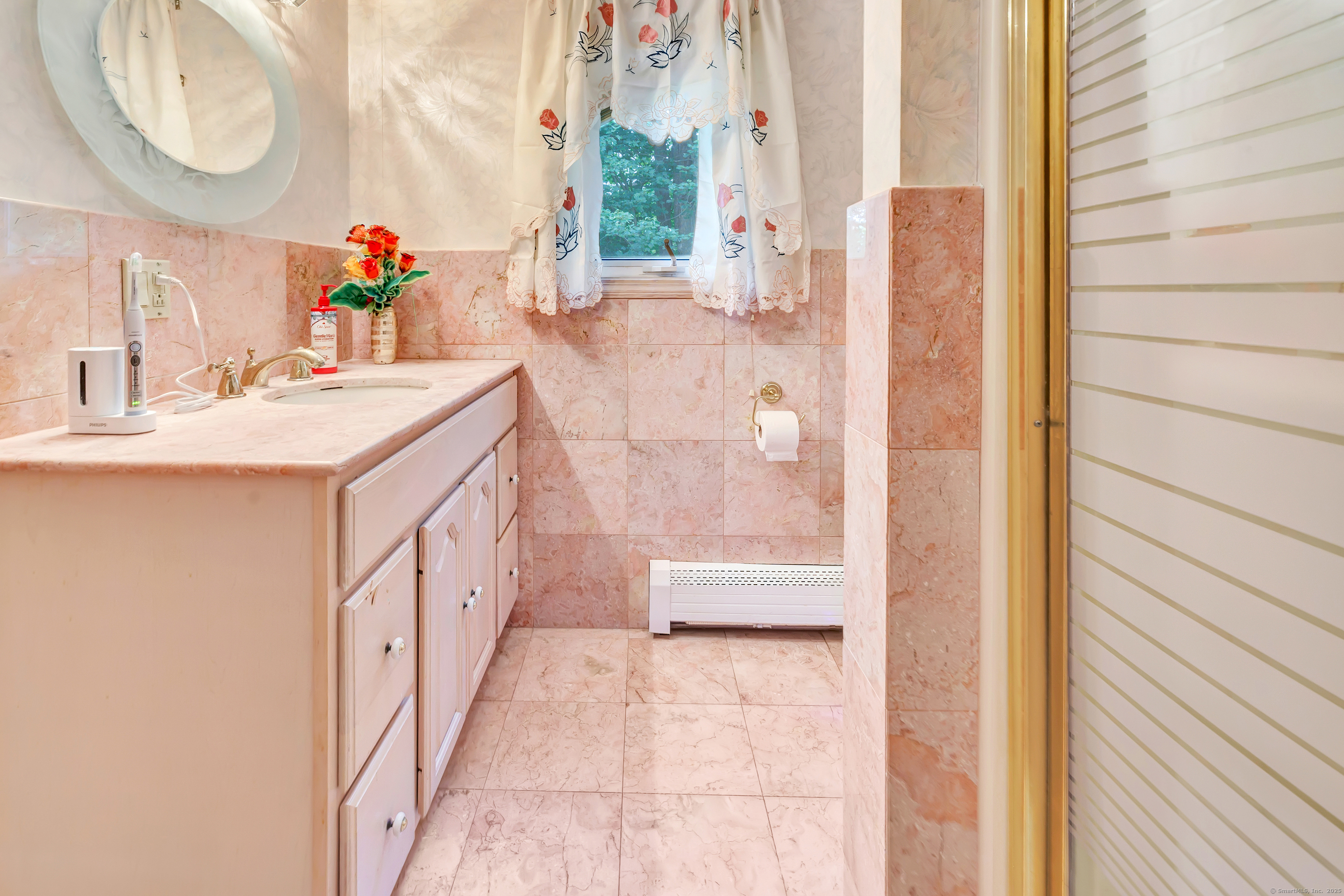 a bathroom with a sink and a mirror