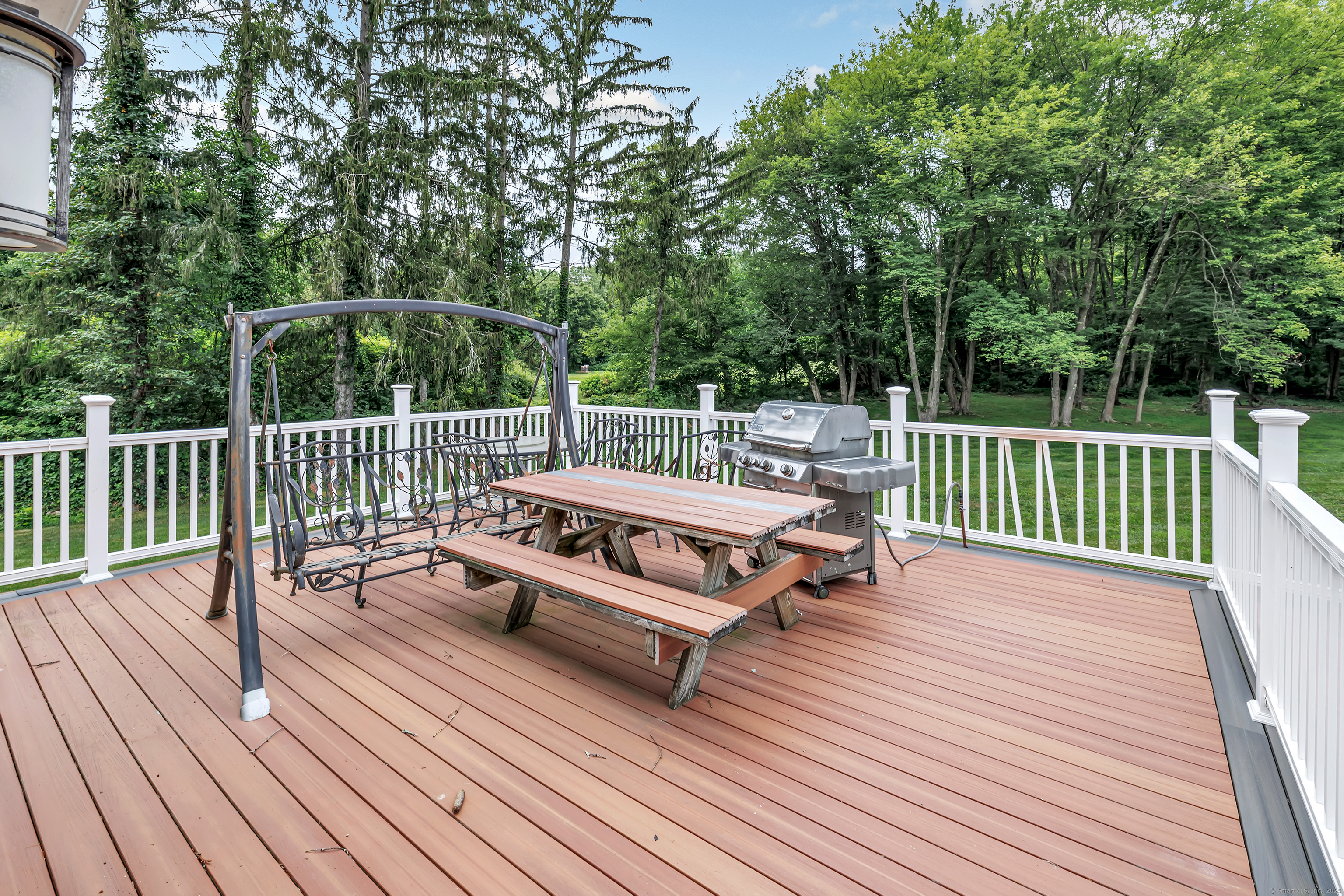 40 Walnut Street Monroe, CT 06468 - Photo 5 of 40 a view of a wooden deck with a bench