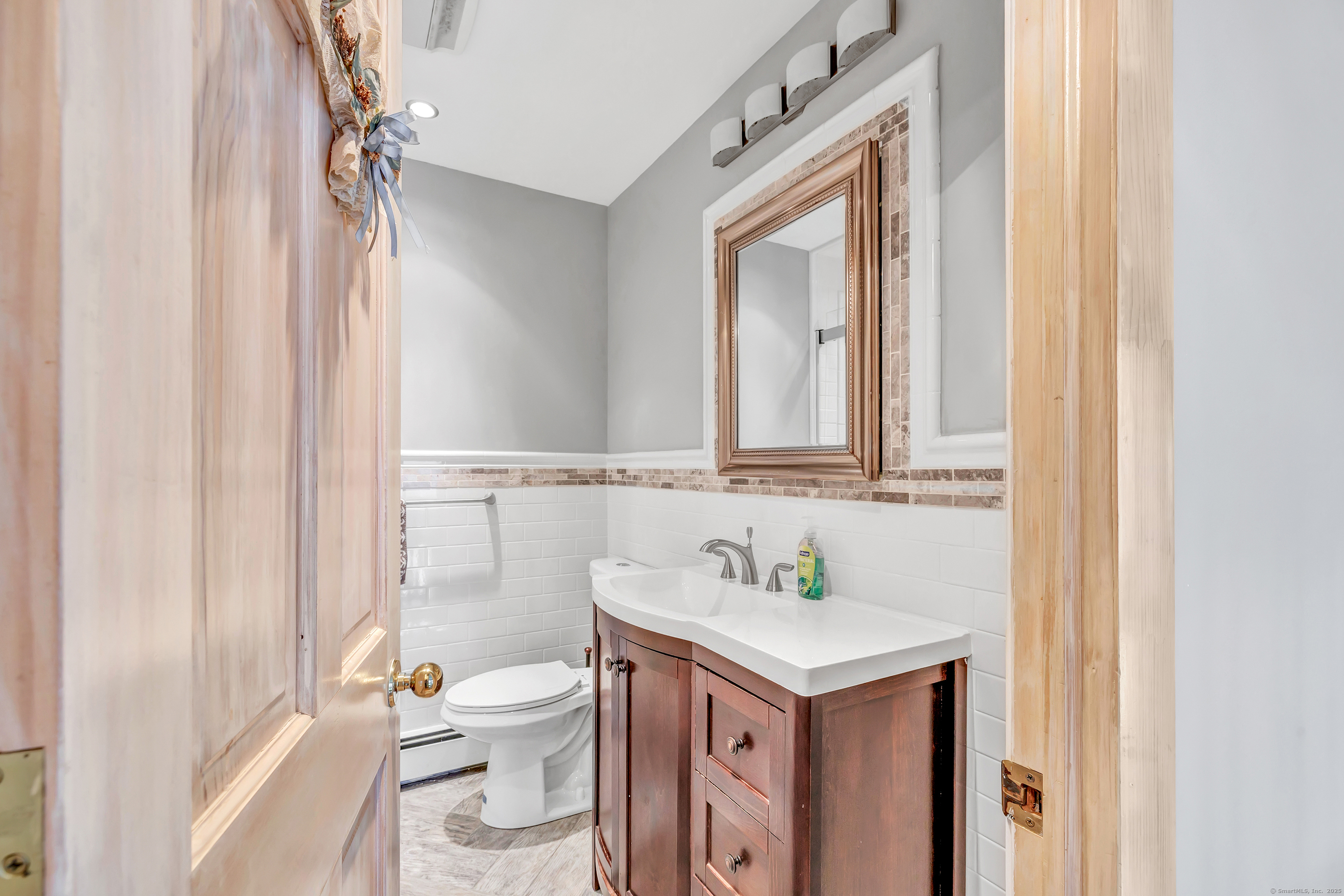 40 Walnut Street Monroe, CT 06468 - Photo 10 of 40 a bathroom with a sink vanity mirror and toilet