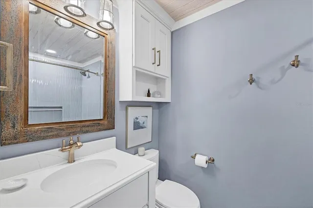 a bedroom with two beds and a table