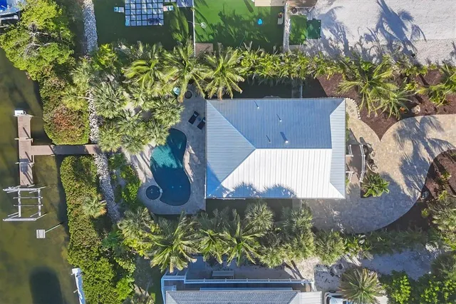 an aerial view of a residential houses with city view