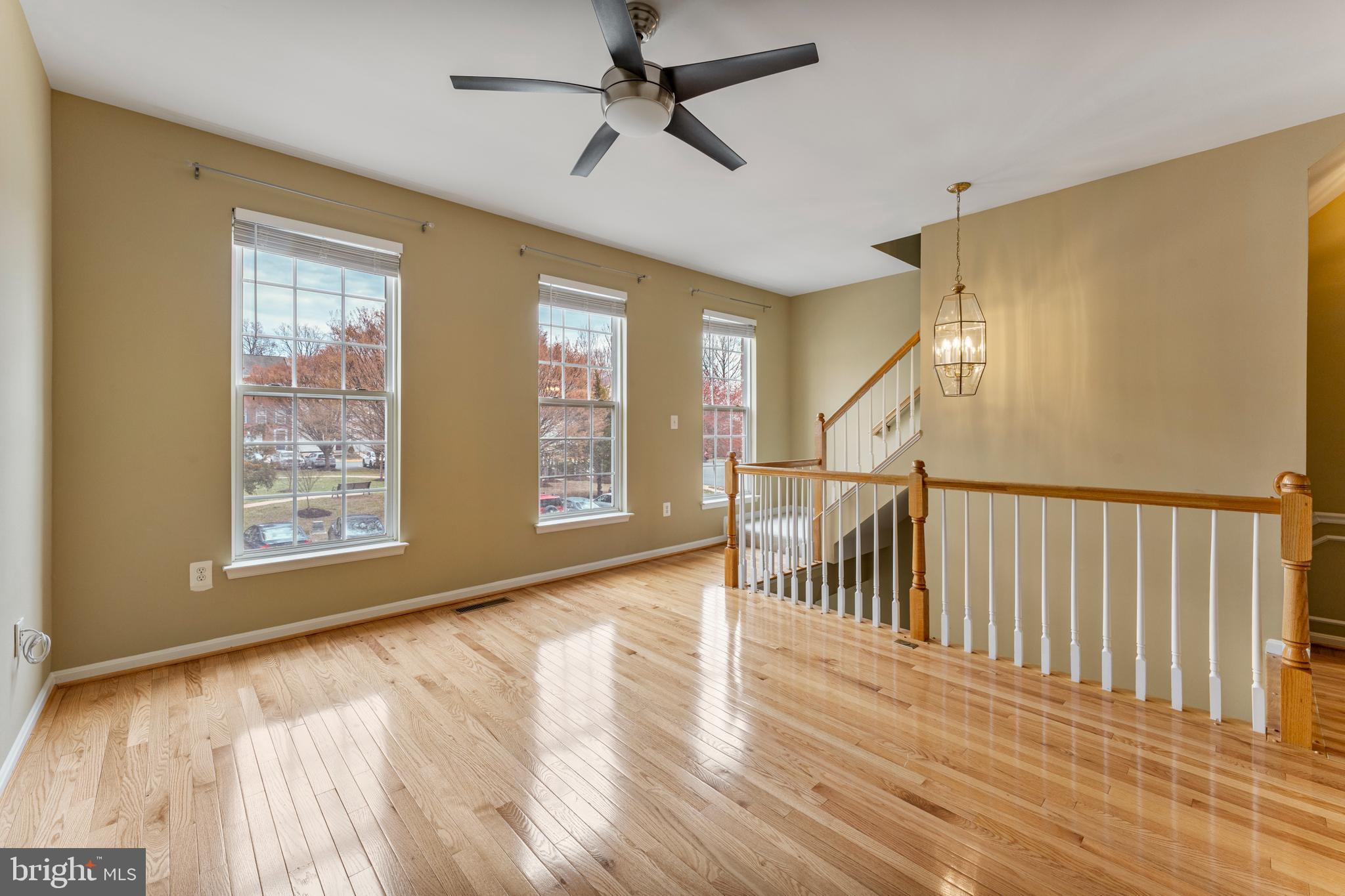 6002 St Hubert Lane Centreville, VA 20121 - Photo 13 of 27 a view of empty room with wooden floor and fan