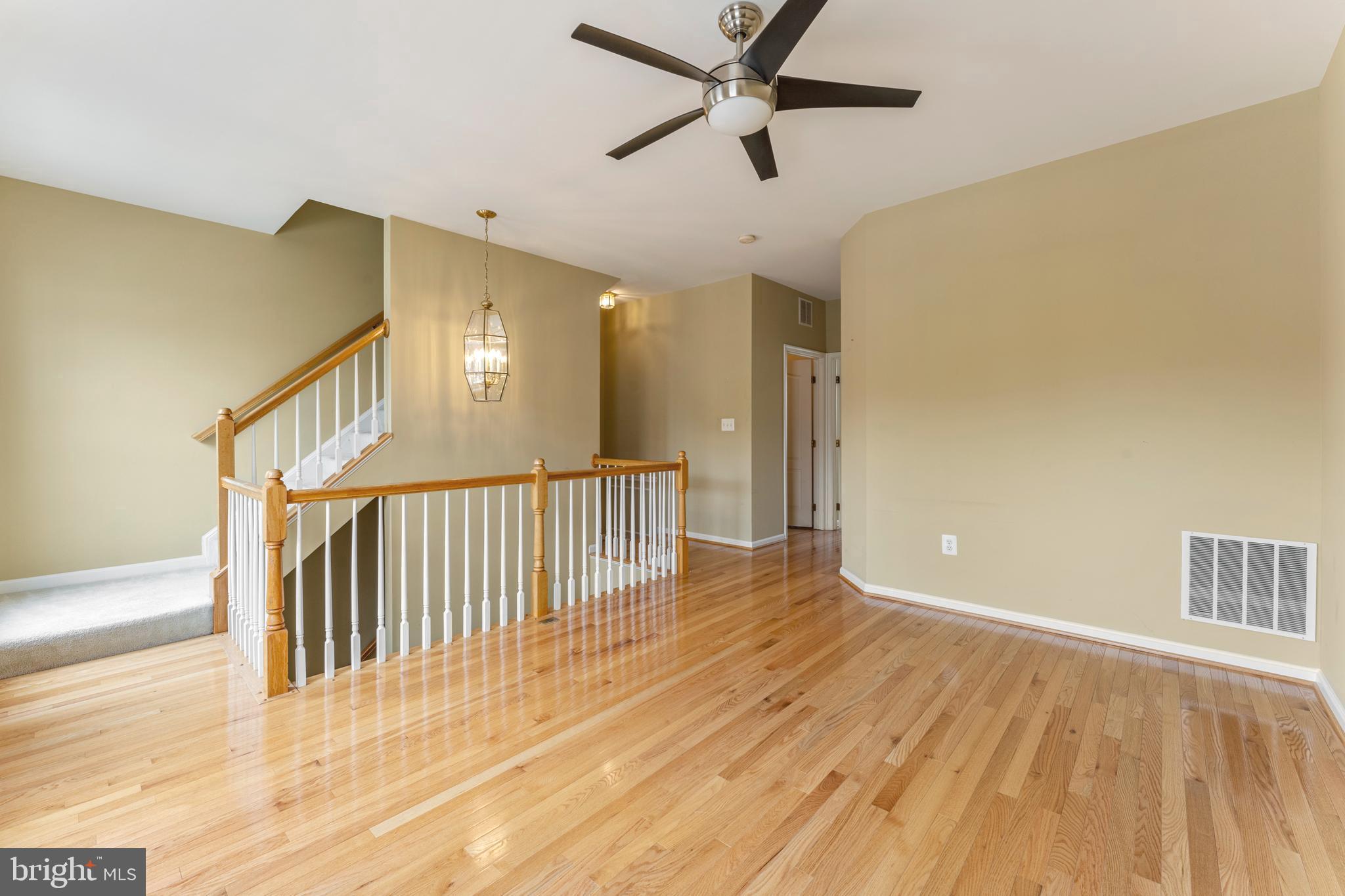 6002 St Hubert Lane Centreville, VA 20121 - Photo 14 of 27 a view of a hallway with wooden floor and entryway