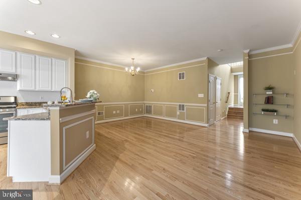 6002 St Hubert Lane Centreville, VA 20121 - Photo 10 of 27 a kitchen with wooden floor and white appliances