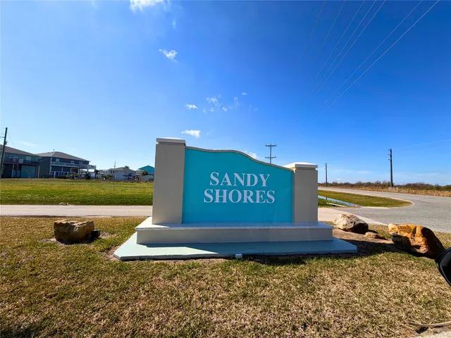 a view of a sign board with ocean view