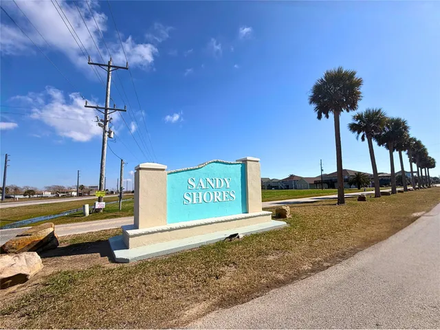 a view of a street with benches in the background