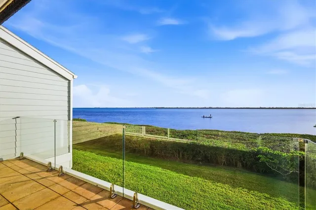 a view of a mini pool table and chairs