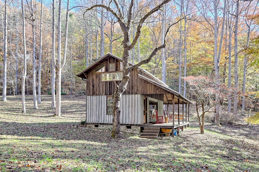 1307 Clear Creek Road Hayesville, NC 28904 - Photo 11 of 65 a view of a house with a yard and wooden fence