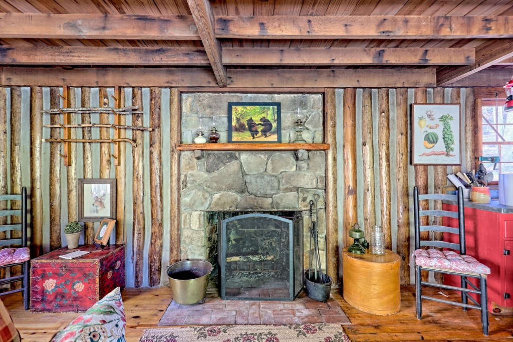 1307 Clear Creek Road Hayesville, NC 28904 - Photo 18 of 65 a living room with furniture and a fireplace