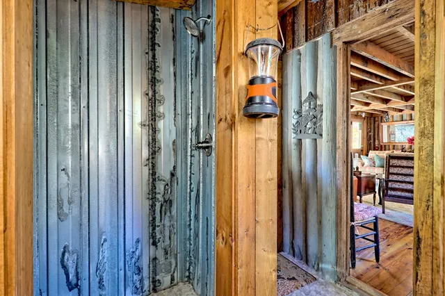 a view of a patio with table and chairs wooden floor and fence
