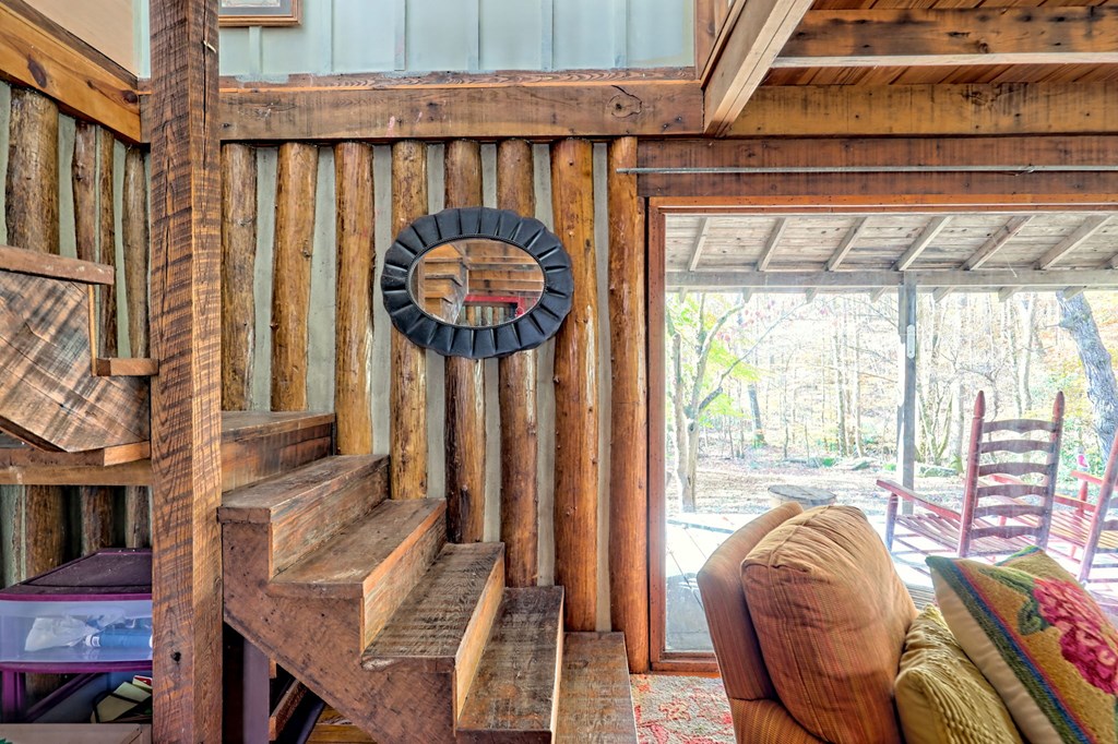 1307 Clear Creek Road Hayesville, NC 28904 - Photo 29 of 65 a front view of a house with wooden floor and furniture