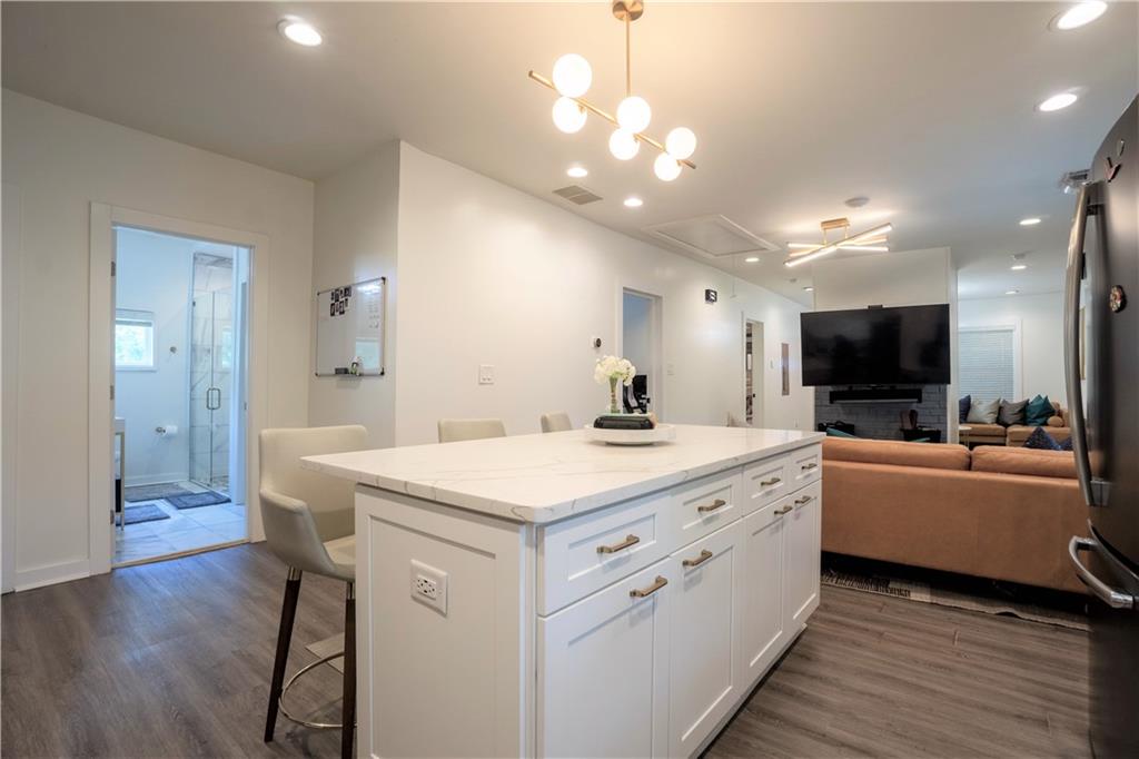 811 King Road Stone Mountain, GA 30088 - Photo 11 of 19 a large kitchen with kitchen island a sink counter space and stainless steel appliances
