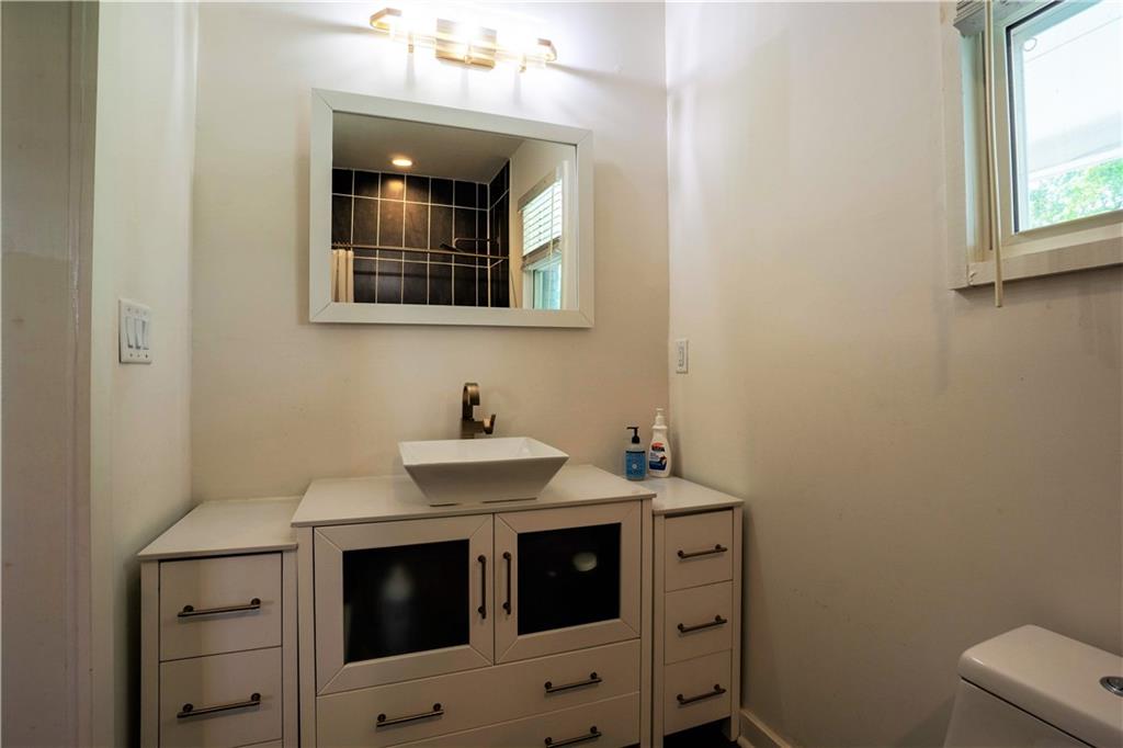 811 King Road Stone Mountain, GA 30088 - Photo 14 of 19 a bathroom with a sink and a mirror