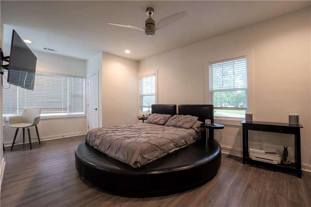 811 King Road Stone Mountain, GA 30088 - Photo 17 of 19 a bed room with a bed and a chair