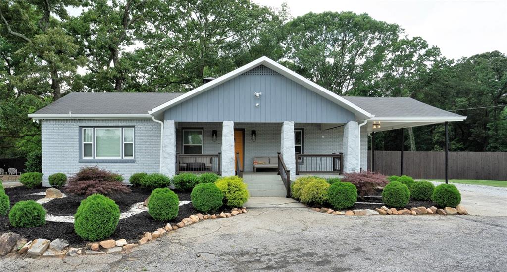 811 King Road Stone Mountain, GA 30088 - Photo 2 of 19 a front view of a house with a garden