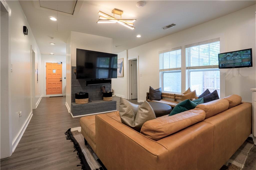811 King Road Stone Mountain, GA 30088 - Photo 5 of 19 a living room with furniture and a flat screen tv