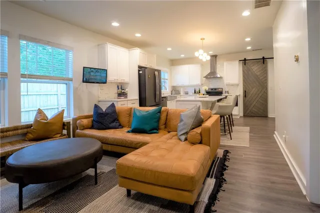 a view of a livingroom with furniture and a fireplace