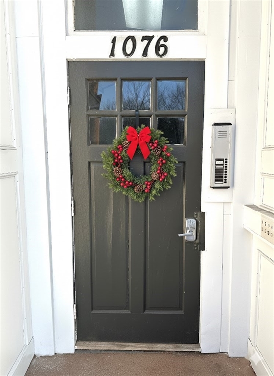 1076 Washington Street, Unit 3 Norwood, MA 02062 - Photo 1 of 8 a front view of a house with garden