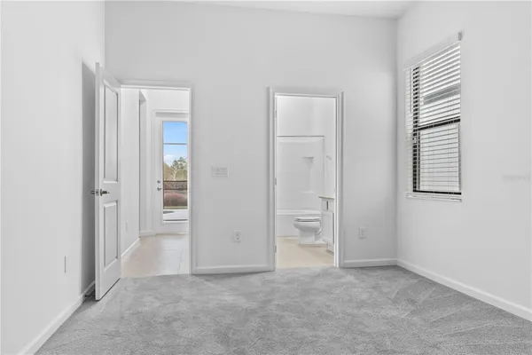 a bathroom with a double vanity sink and mirror