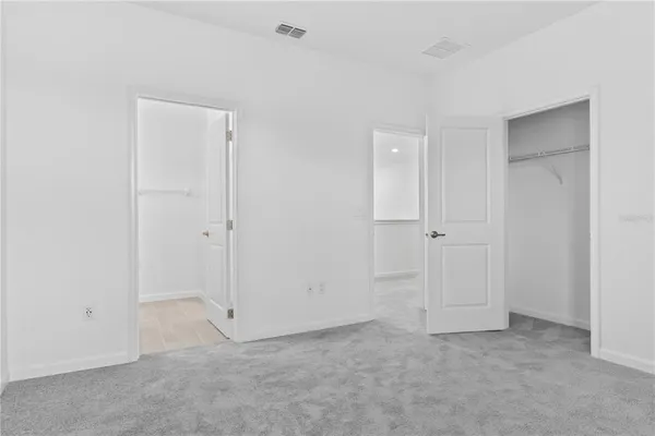 a aerial view of a house with swimming pool outdoor seating and yard