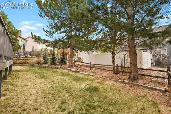 a view of a yard with swimming pool