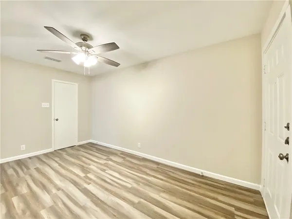a view of a big room with carpet
