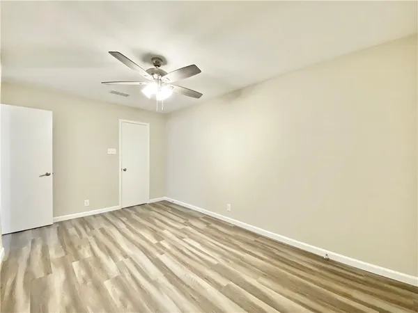 a view of cabinets and wooden floor
